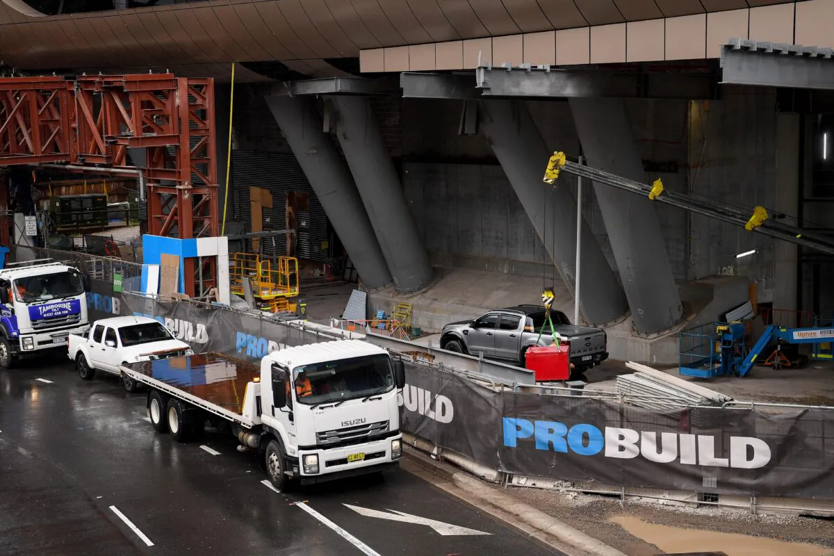 Signage and construction machinary are seen onsite at The Ribbon project at Darling Harbour in Sydney, Australia, Feb. 24, 2022. (AAP Image/Bianca De Marchi)