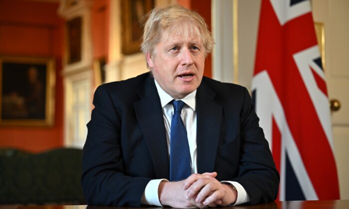 Prime Minister Boris Johnson records an address to the nation after he chaired an emergency Cobra meeting to discuss the UK response to the crisis in Ukraine, in Downing Street, central London, on Feb. 24, 2022. (Jeff J Mitchell - WPA Pool /Getty Images)