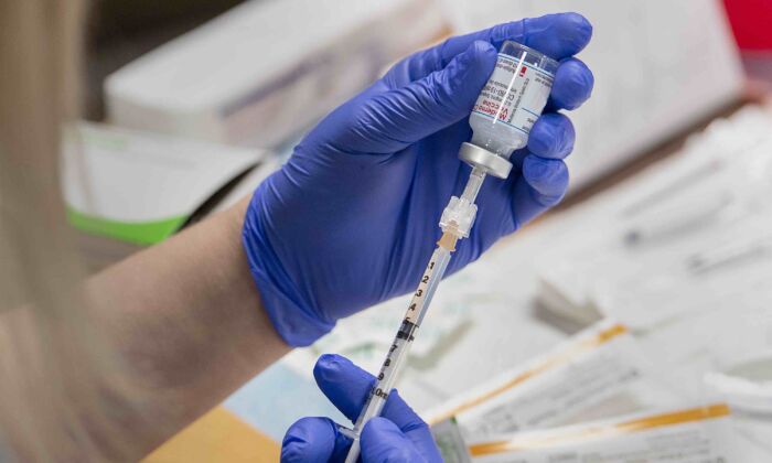 A nurse prepares a dose of the Moderna vaccine in Halifax, Canada, on Jan. 11, 2021. (Andrew Vaughan-Pool/The Canadian Press)