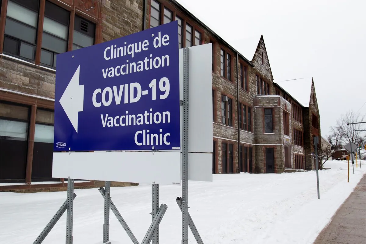 A sign for a vaccination clinic is shown in Moncton, New Brunswick on Jan. 14, 2022. (THE CANADIAN PRESS/Ron Ward)