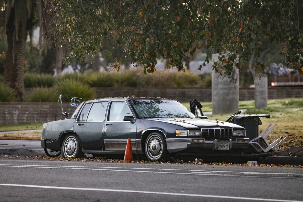Homeless individuals live out of a car in a file photo in Los Angeles on Jan. 20, 2022. (John Fredricks/The Epoch Times)