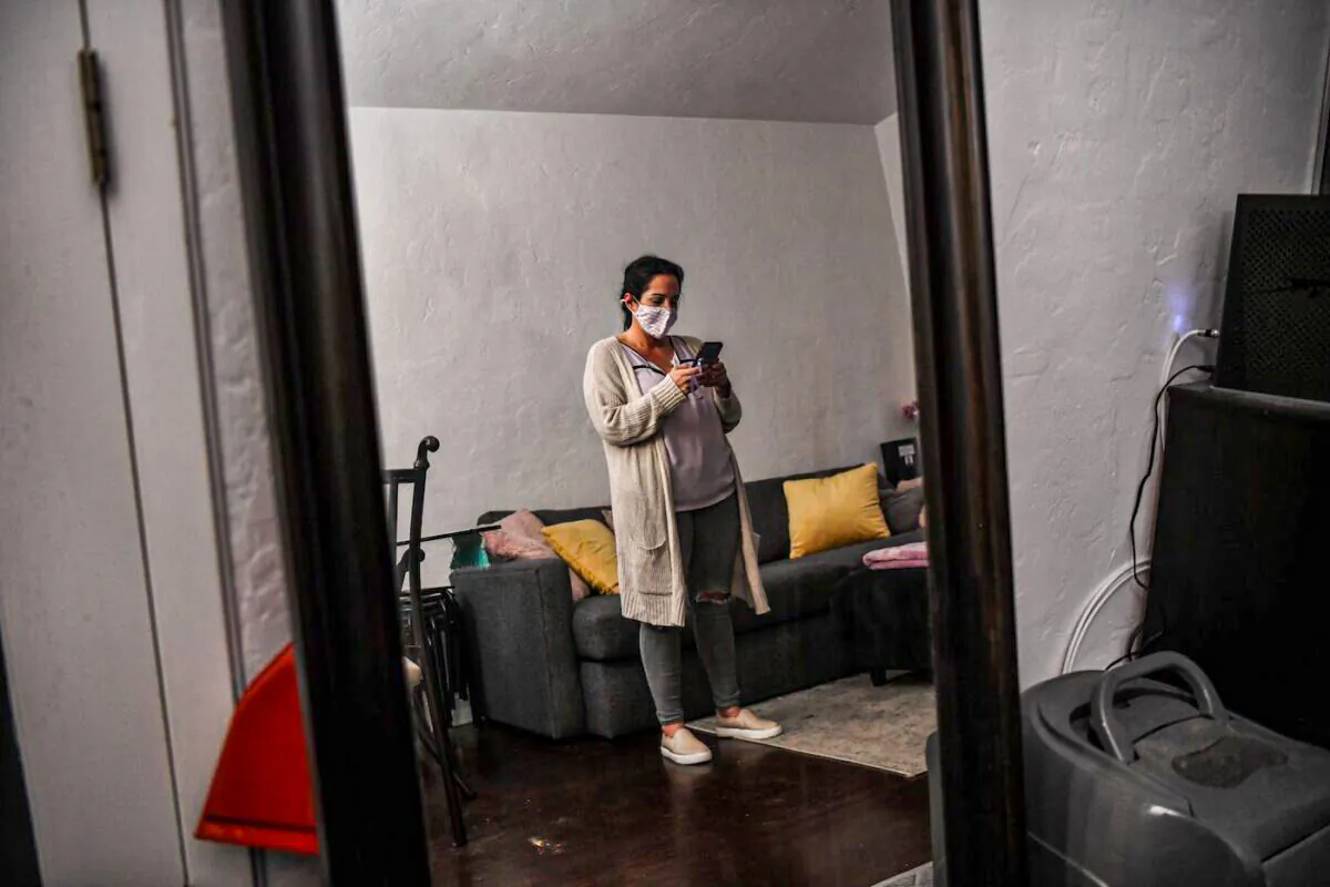 A Florida woman in her Miami Beach home on Feb. 20, 2021, during the COVID-19 pandemic. (Chandan Khanna/AFP via Getty Images)
