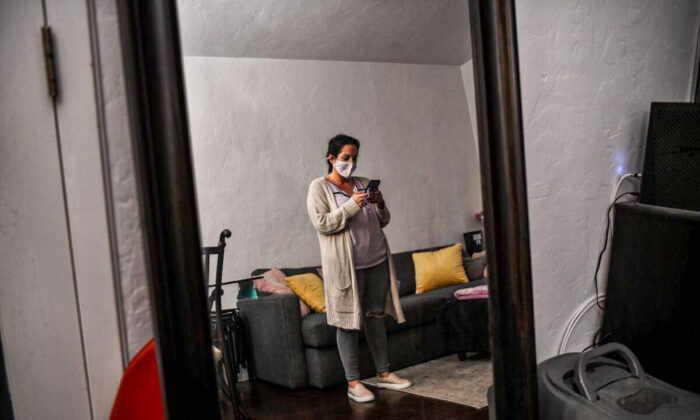 A Florida woman in her Miami Beach home on Feb. 20, 2021, during the COVID-19 pandemic. (Chandan Khanna/AFP via Getty Images)
