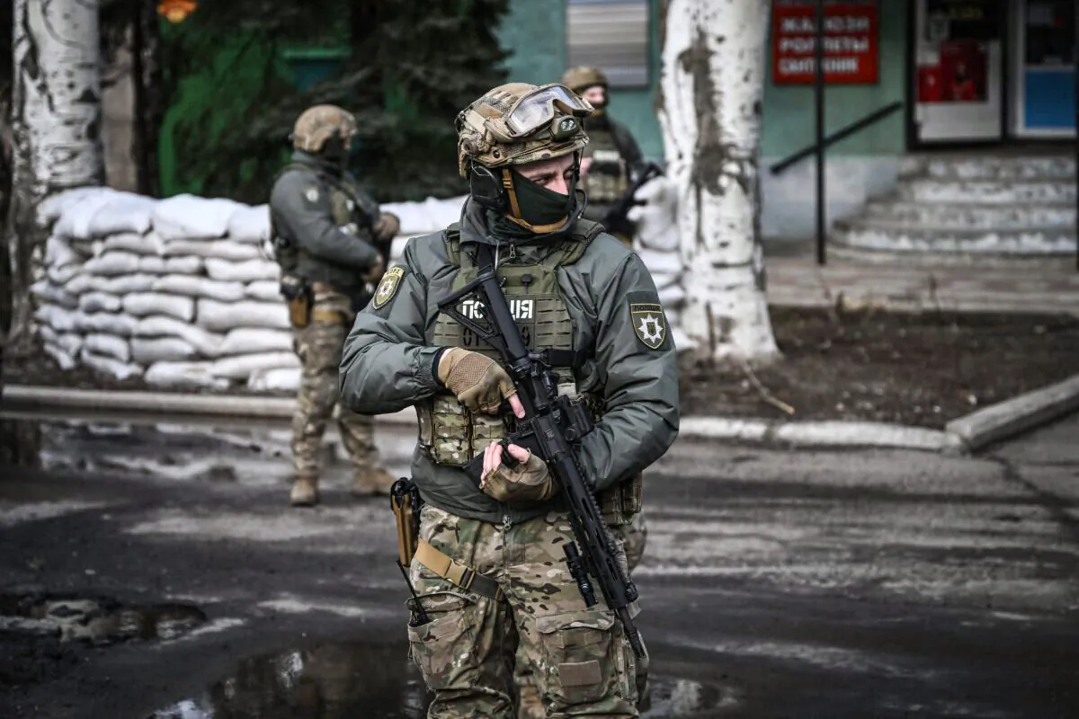 Ukrainian troops patrol in the town of Novoluhanske, eastern Ukraine, on Feb. 19, 2022. (Aris Messinis/AFP via Getty Images)