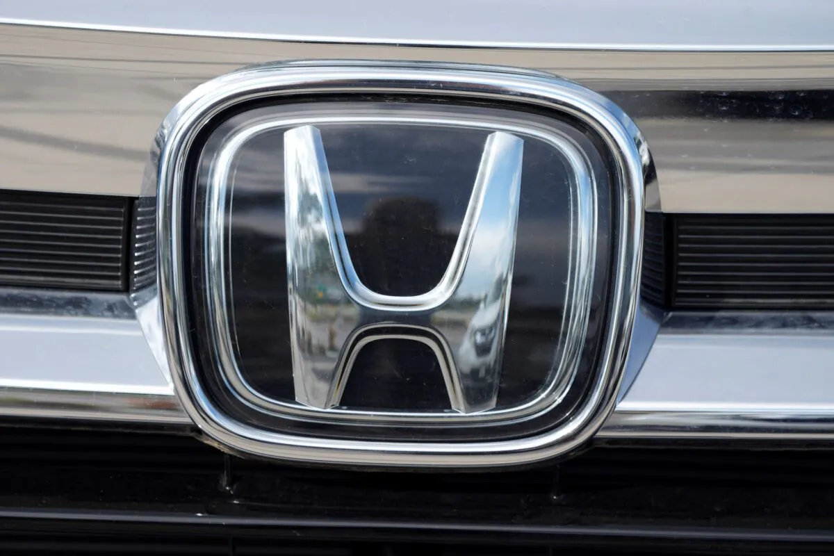 The Honda company logo is shown outside a Honda dealership in Highlands Ranch, Colo., on Sept. 12, 2021. (David Zalubowski/AP Photo)