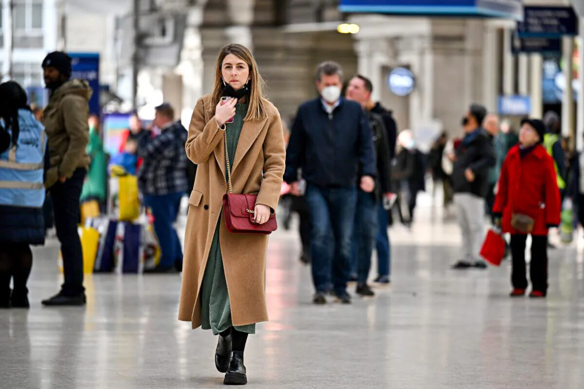 Commuters are seen in Waterloo station in London, on Feb. 23, 2022. (Jeff J Mitchell /Getty Images)