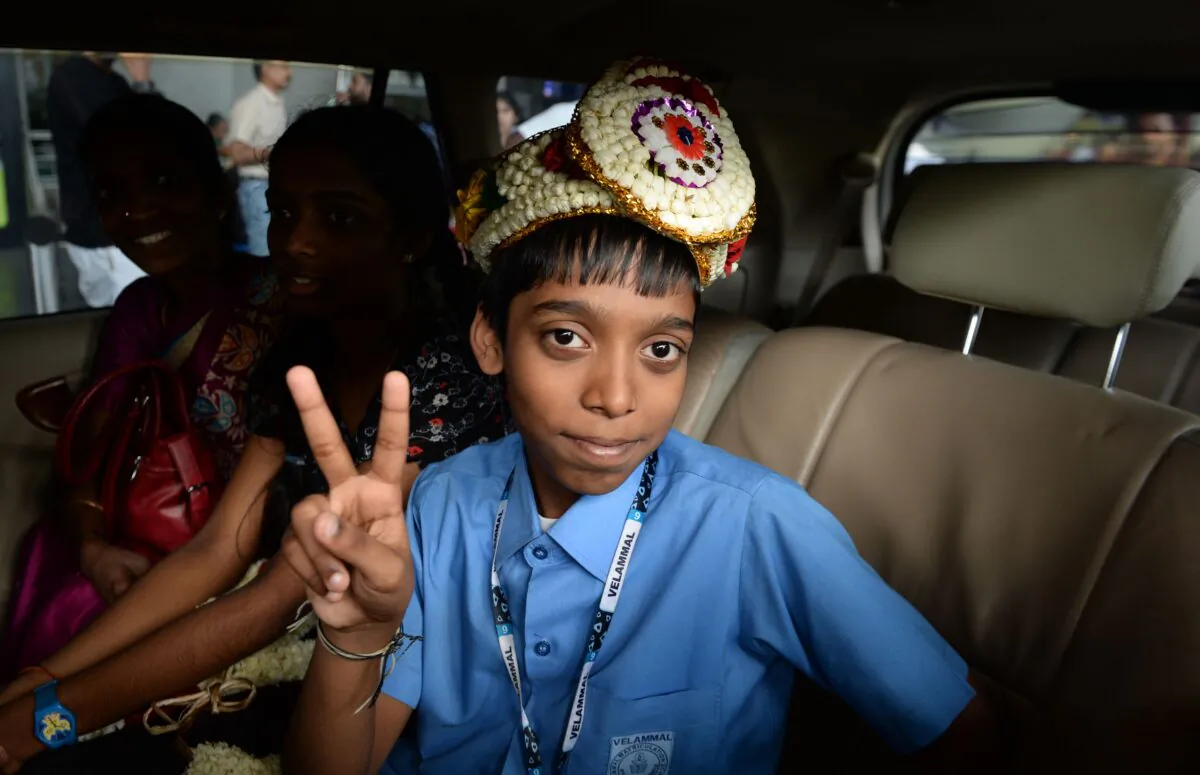 Indian chess prodigy Rameshbabu Praggnanandhaa poses for a photograph on his arrival at an airport in Chennai on June 26, 2018. (Arun Sankar/AFP via Getty Images)