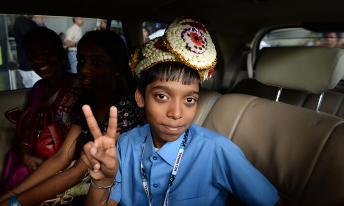 Indian chess prodigy Rameshbabu Praggnanandhaa poses for a photograph on his arrival at an airport in Chennai on June 26, 2018. (Arun Sankar/AFP via Getty Images)