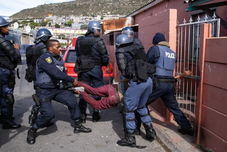 Police in Cape Town, South Africa, arrest a suspect on Nov. 21, 2021. Citizens' trust in the police, though, has plummeted after decades of high crime. (Courtesy of the South African Police Service.)