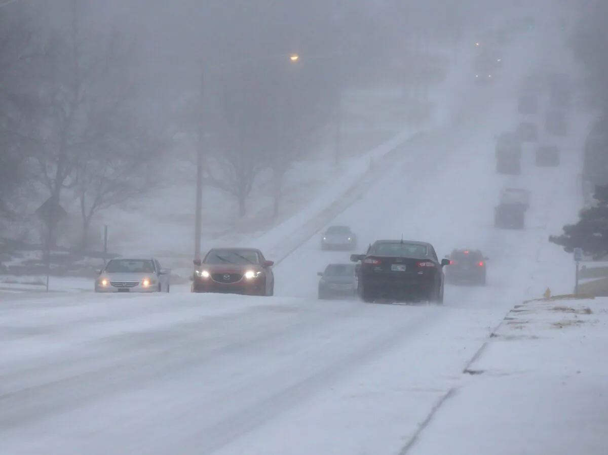 Motorists drive during a sleet storm in Tulsa, Okla., on Feb. 23, 2022. (Stephen Pingry/Tulsa World via AP)