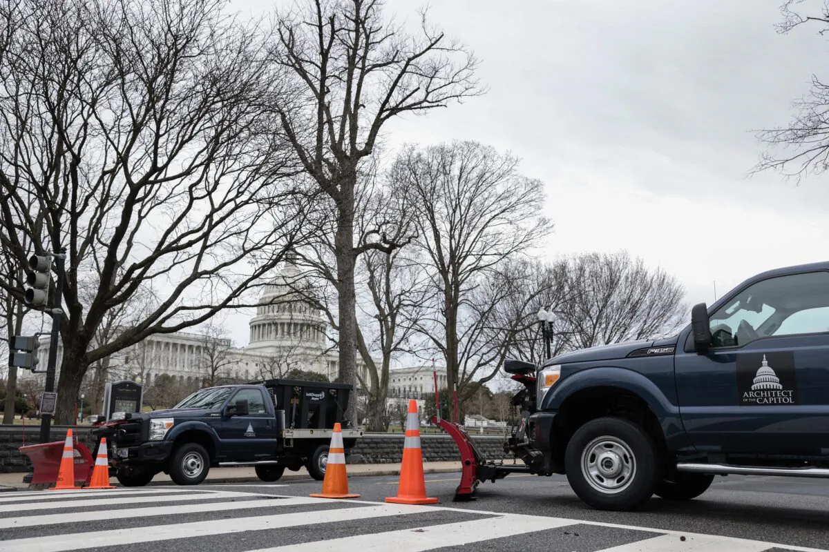 Pick-up trucks are used to close First Street SW near the U.S. Capitol Building in Washington on Feb. 23, 2022. (Anna Moneymaker/Getty Images)