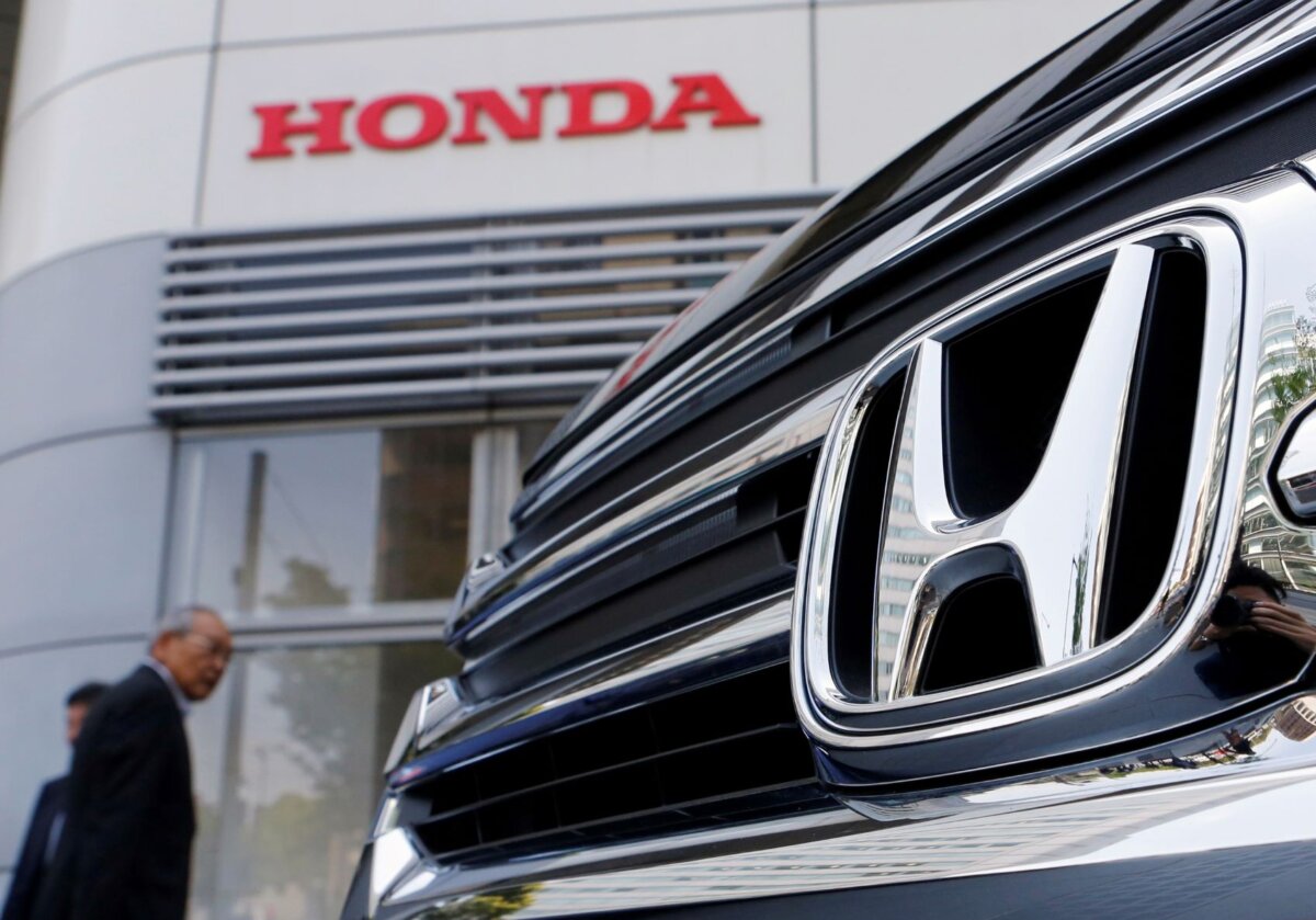 Visitors look at a Honda Motor Co. car displayed outside the company showroom in Tokyo, Japan, on April 26, 2013. (Yuya Shino / Reuters)