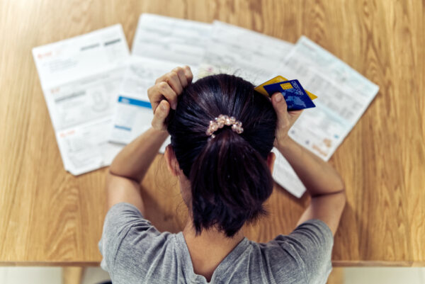 Top,View,Of,Stressed,Young,Sitting,Asian,Woman,Hands,Holding