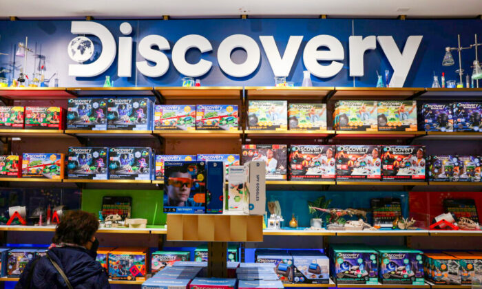 The Discovery Inc. logo is seen on a display in the FAO Schwarz toy store in Manhattan, New York, on Nov. 24, 2021. (Andrew Kelly/Reuters)