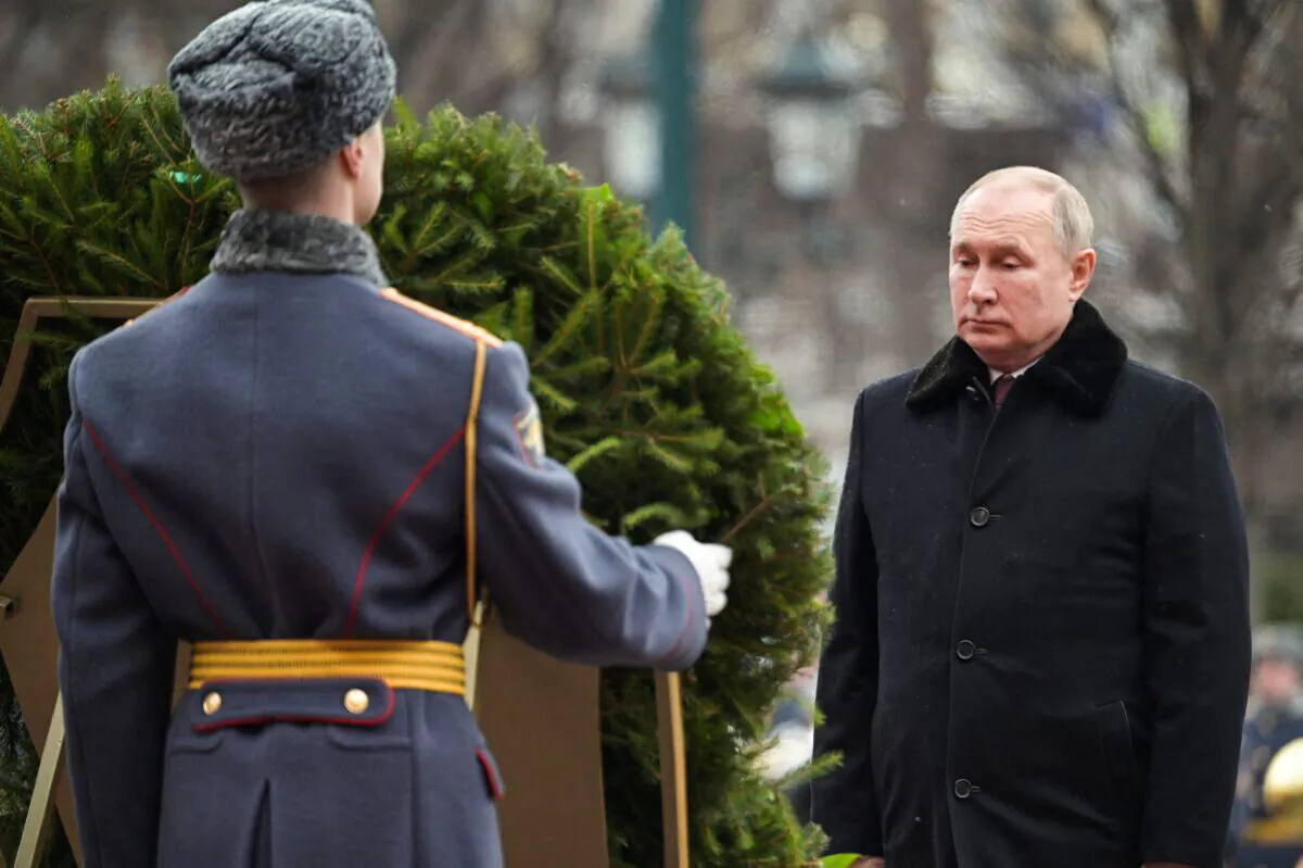Russian President Vladimir Putin takes part in a wreath laying ceremony at the Tomb of the Unknown Soldier by the Kremlin Wall on the Defender of the Fatherland Day in Moscow, Russia, on Feb. 23, 2022. (Sputnik/Aleksey Nikolskyi/Kremlin via Reuters)