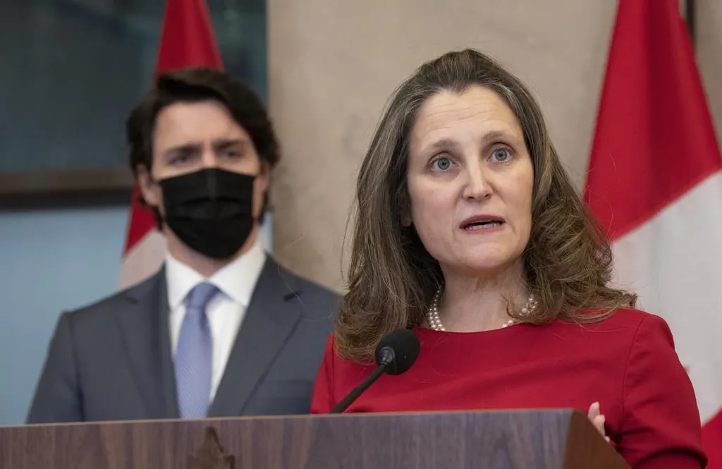 Prime Minister Justin Trudeau looks on as Deputy Prime Minister and Finance Minister Chrystia Freeland speaks following a cabinet retreat, Jan. 26, 2022 in Ottawa. (The Canadian Press/Adrian Wyld)