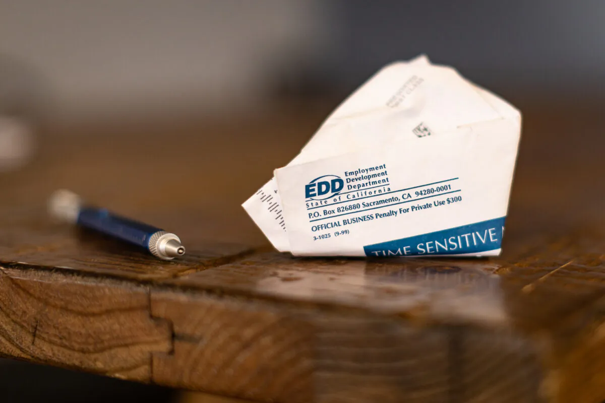 A discarded envelope containing EDD information sits on a desk in Irvine, Calif., on April 21, 2021. (John Fredricks/The Epoch Times)