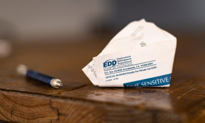 A discarded envelope containing EDD accusation  sits successful  Irvine, Calif., connected  April 21, 2021. (John Fredricks/The Epoch Times)