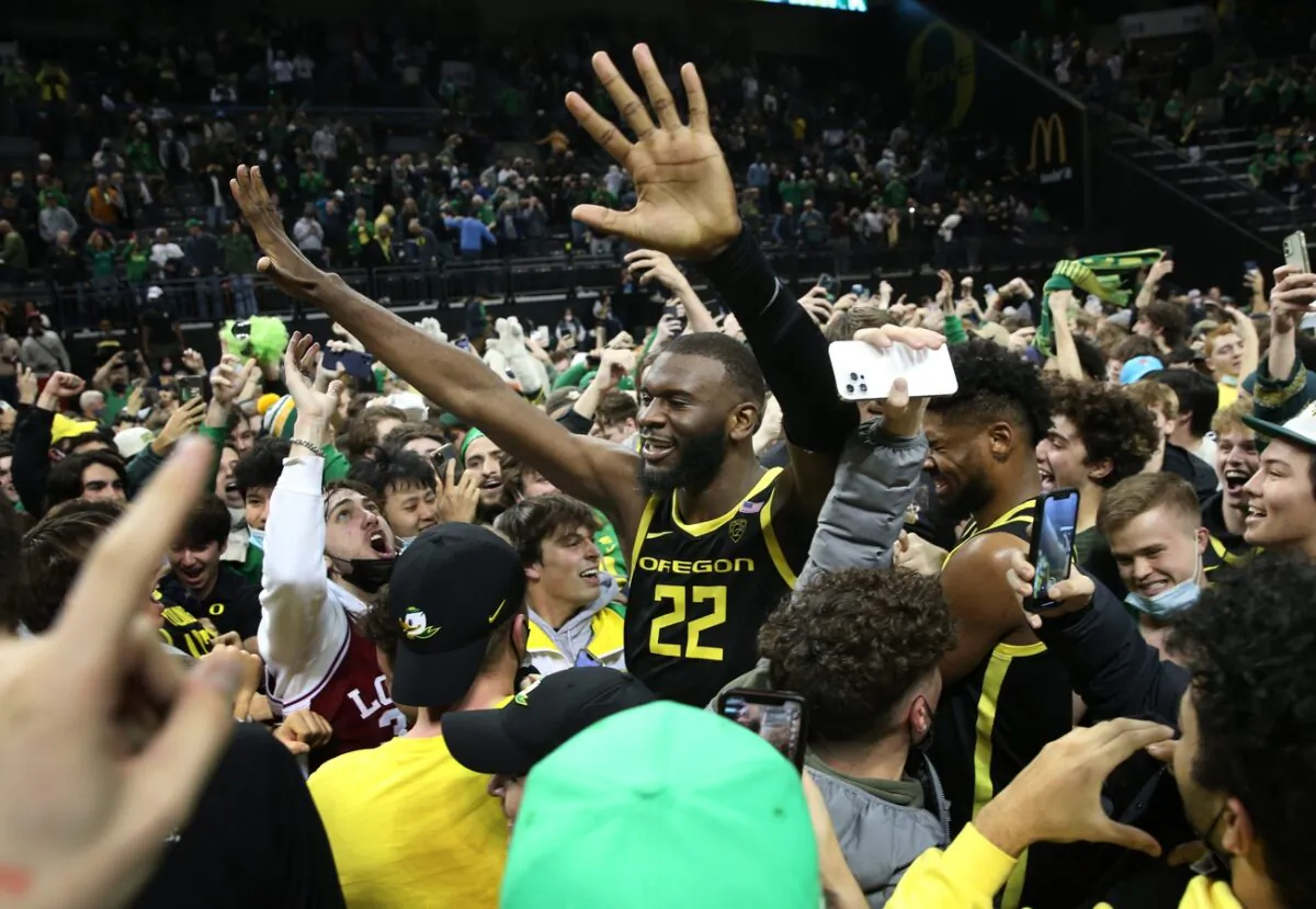 Oregon's Franck Kepnang celebrates with fans after winning over UCLA on Feb. 24, 2022. (Chris Pietsch/The Register-Guard/USA TODAY NETWORK via Field Level Media)