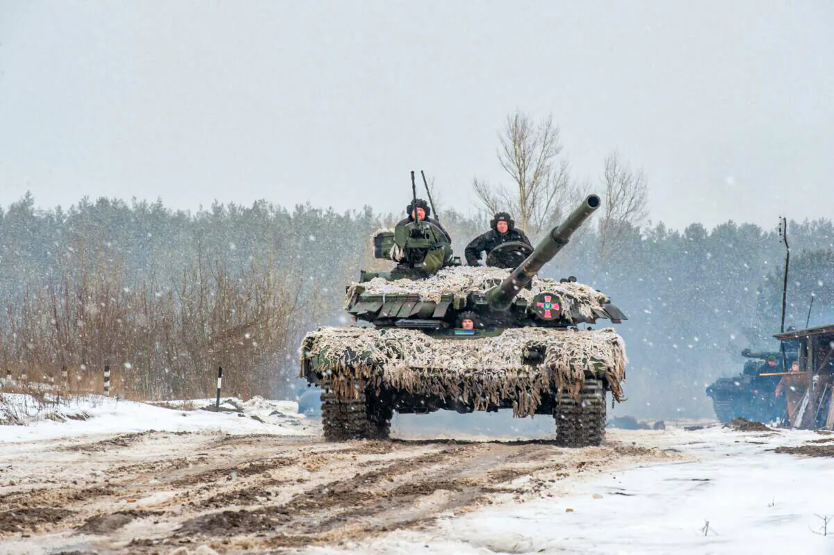 Ukrainian Military Forces servicemen of the 92nd mechanized brigade use tanks, self-propelled guns, and other armored vehicles to conduct live-fire exercises near the town of Chuguev, in Kharkiv region, on Feb. 10, 2022. (Sergey Bobok/AFP via Getty Images)