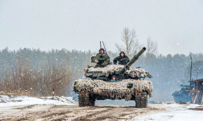 Ukrainian Military Forces servicemen of the 92nd mechanized brigade use tanks, self-propelled guns and other armored vehicles to conduct live-fire exercises near the town of Chuguev, in Kharkiv region, on Feb. 10, 2022. (Sergey BOBOK / AFP via Getty Images)