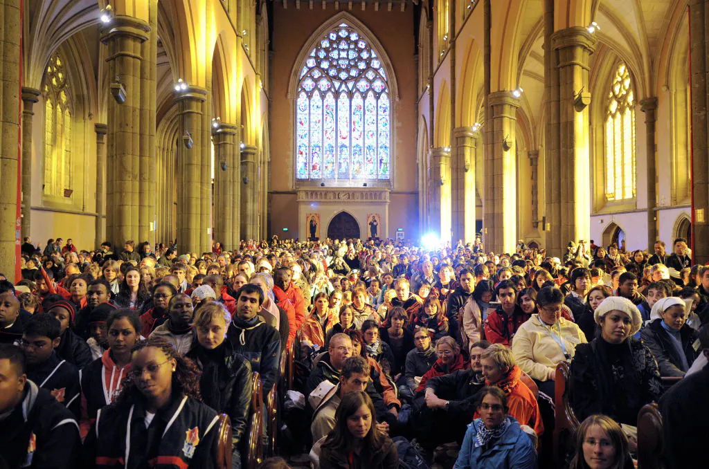 Young pilgrims from around the world listen to a service at St Patrick's Cathedral to celebrate the arrival in Australia of young pilgrims for World Youth Day in Melbourne, Australia, on July 10, 2008. (William West/AFP via Getty Images)