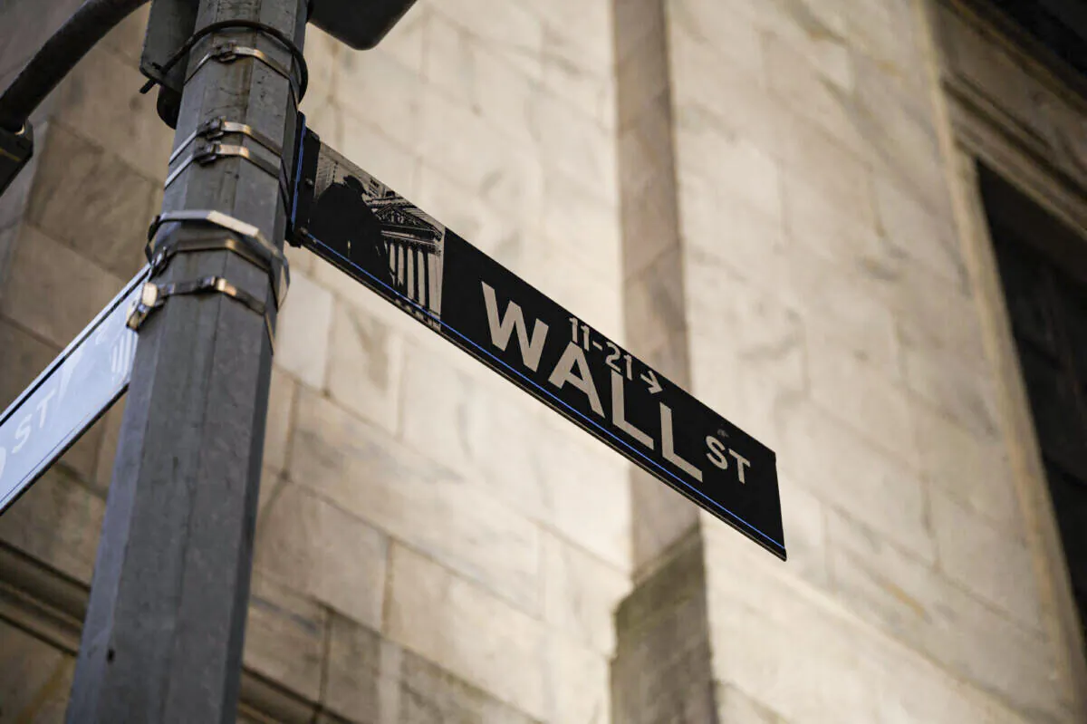A Wall Street sign outside the New York Stock Exchange (NYSE), on Jan. 24, 2022. (Ed Jones/AFP via Getty Images)
