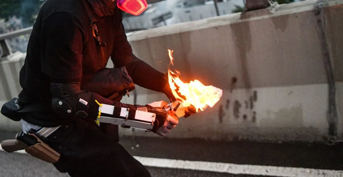 A file photo of a man holding a lit Molotov cocktail bomb. (Anthony Wallace/AFP/Getty Images)