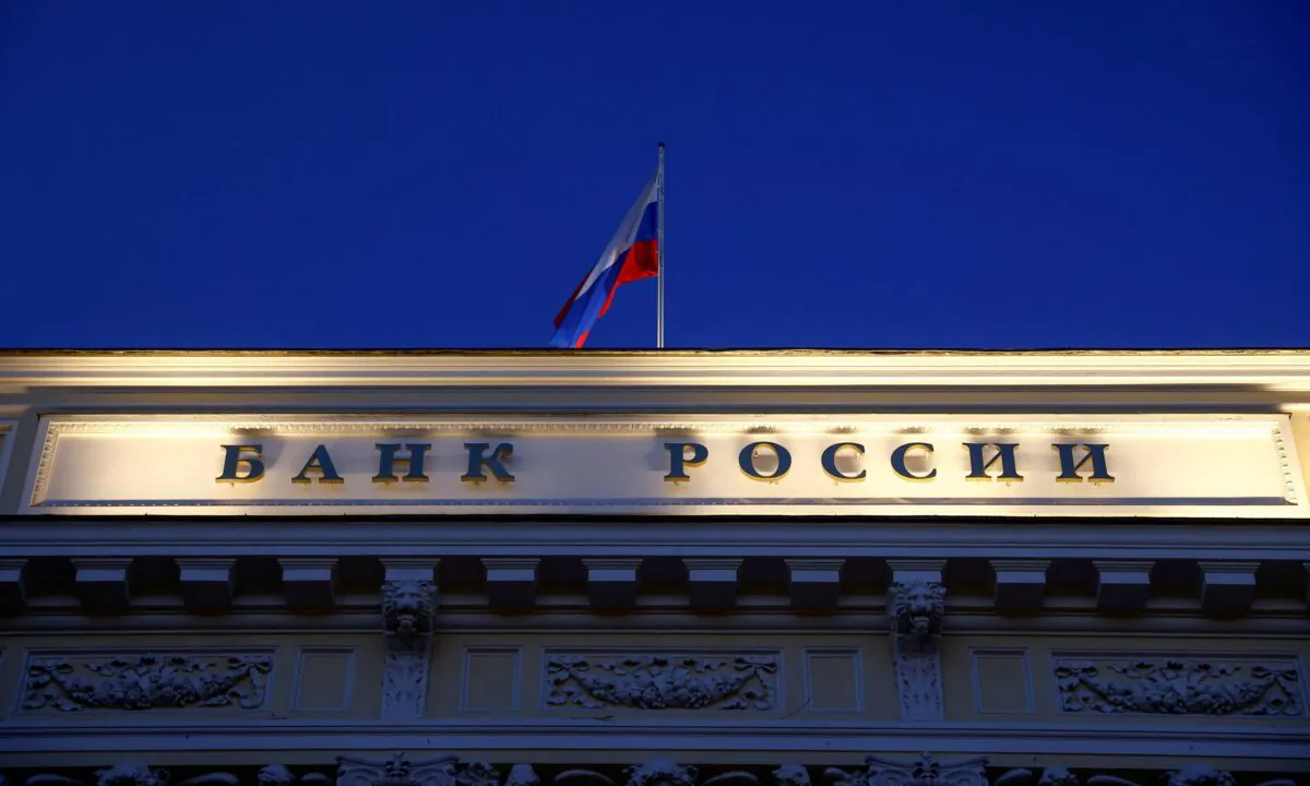 A Russian state flag flies over the Central Bank headquarters in Moscow, Russia, on March 29, 2021. (Maxim Shemetov/Reuters)