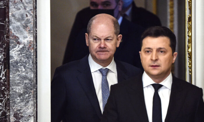 German Chancellor Olaf Scholz (L) and Ukrainian President Volodymyr Zelenskyy arrive to hold a joint press conference in Kyiv, on Feb. 14, 2022. (Sergei Supinsky/AFP via Getty Images)