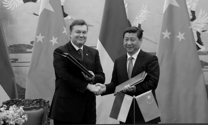 Ukrainian President Viktor Yanukovych (L) shakes hands with Chinese leader Xi Jinping during a signing ceremony at the Great Hall of the People in Beijing, China on Dec. 5, 2013. (WANG ZHAO/AFP via Getty Images)
