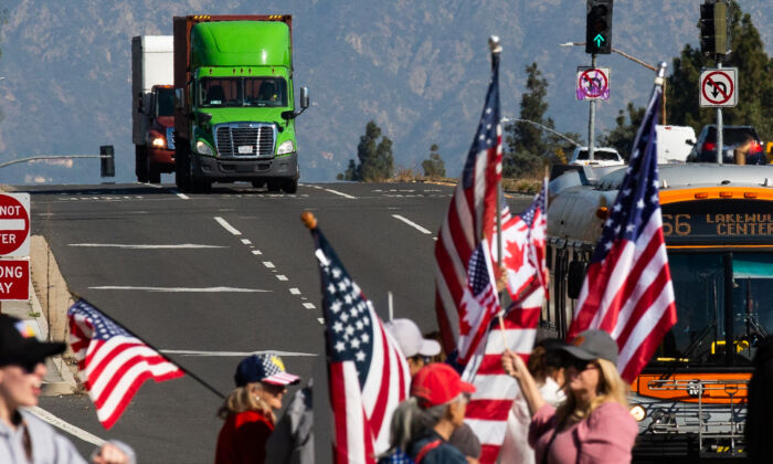 People gather in El Monte, Calif., to show support for truckers partaking in a convoy from Los Angeles to Washington, D.C in protest of mask and vaccine mandates on Feb. 25, 2022. (John Fredricks/The Epoch Times)
