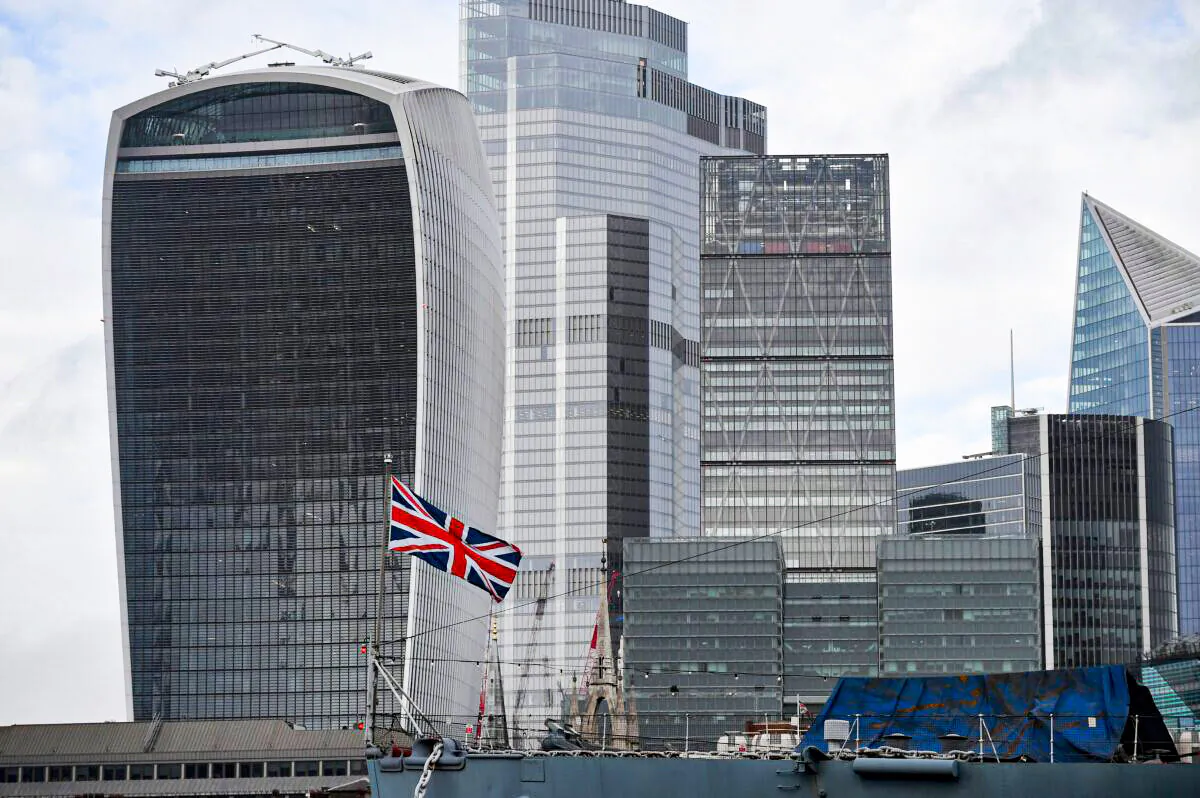 A Union Flag flies from HMS Belfast moored on the River Thames in the shadow of the office buildings of the City of London, in London, on Nov. 1, 2020. (Justin Tallis/AFP via Getty Images)