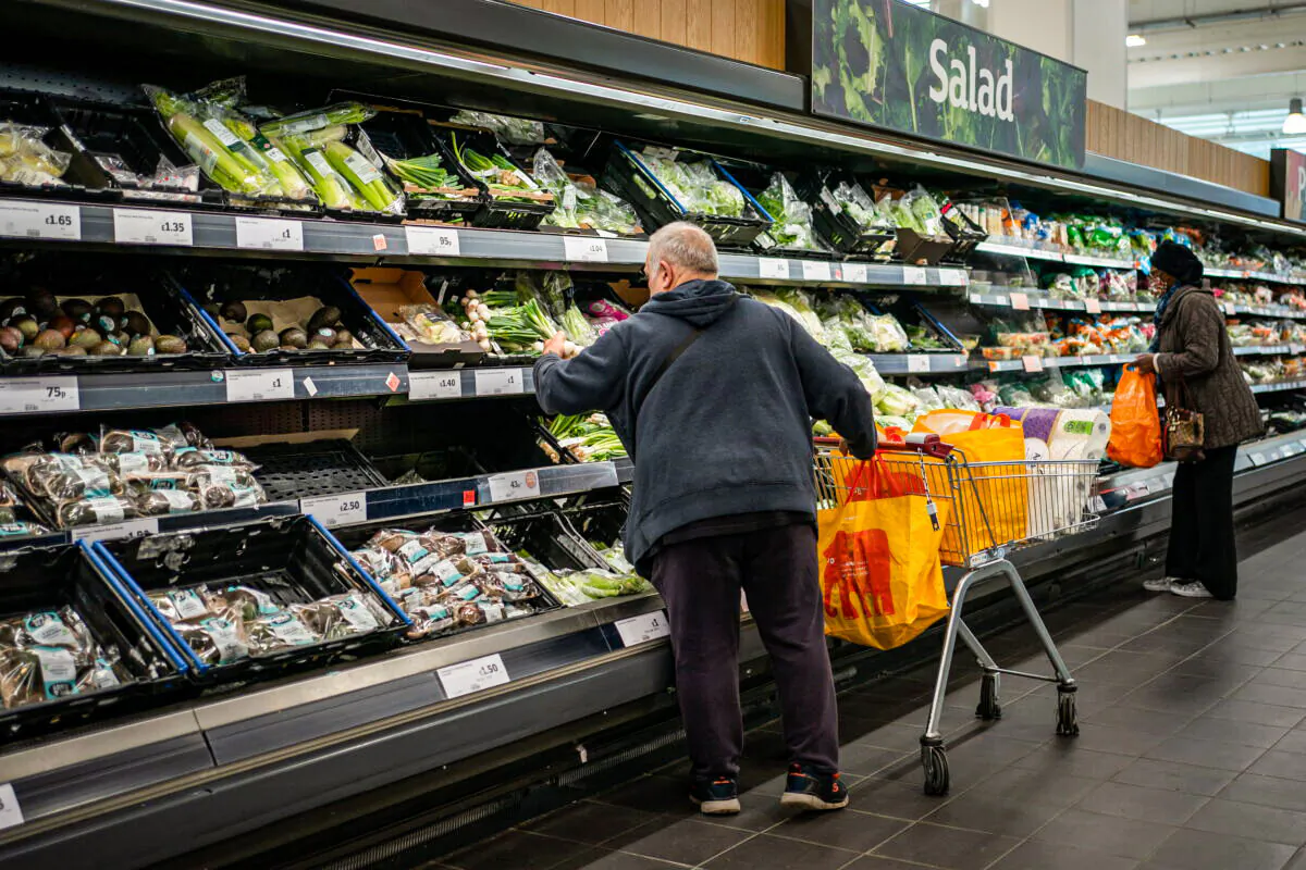 People shop at a supermarket. (Aaron Chown/PA)