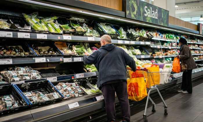 People shop at a supermarket. (Aaron Chown/PA)