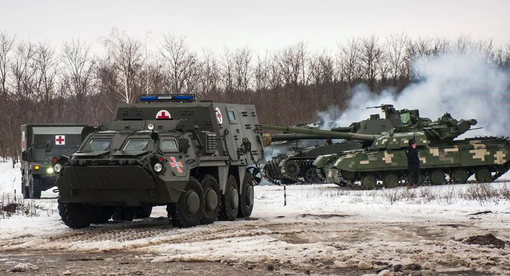 Ukrainian armored vehicles drive during military drills close to Kharkiv, Ukraine, on Feb. 10, 2022. (Andrew Marienko/AP)