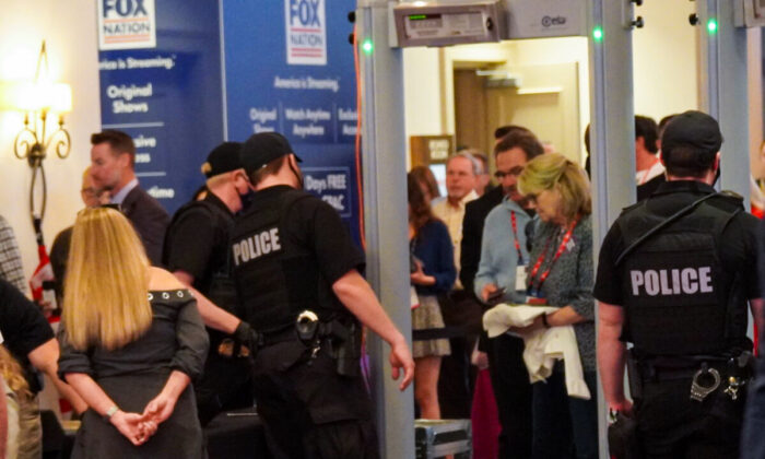 CPAC attendees make their way slowly through Secret Service security checks on the morning of Feb. 26 in anticipation of an evening appearance at the event by Former President Donald Trump. (Natasha Holt/The Epoch Times)