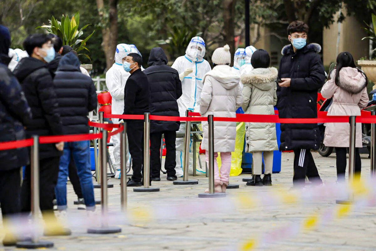 Residents queue to undergo tests for COVID-19 in Suzhou, China, on Feb. 16, 2022. (STR/AFP via Getty Images)