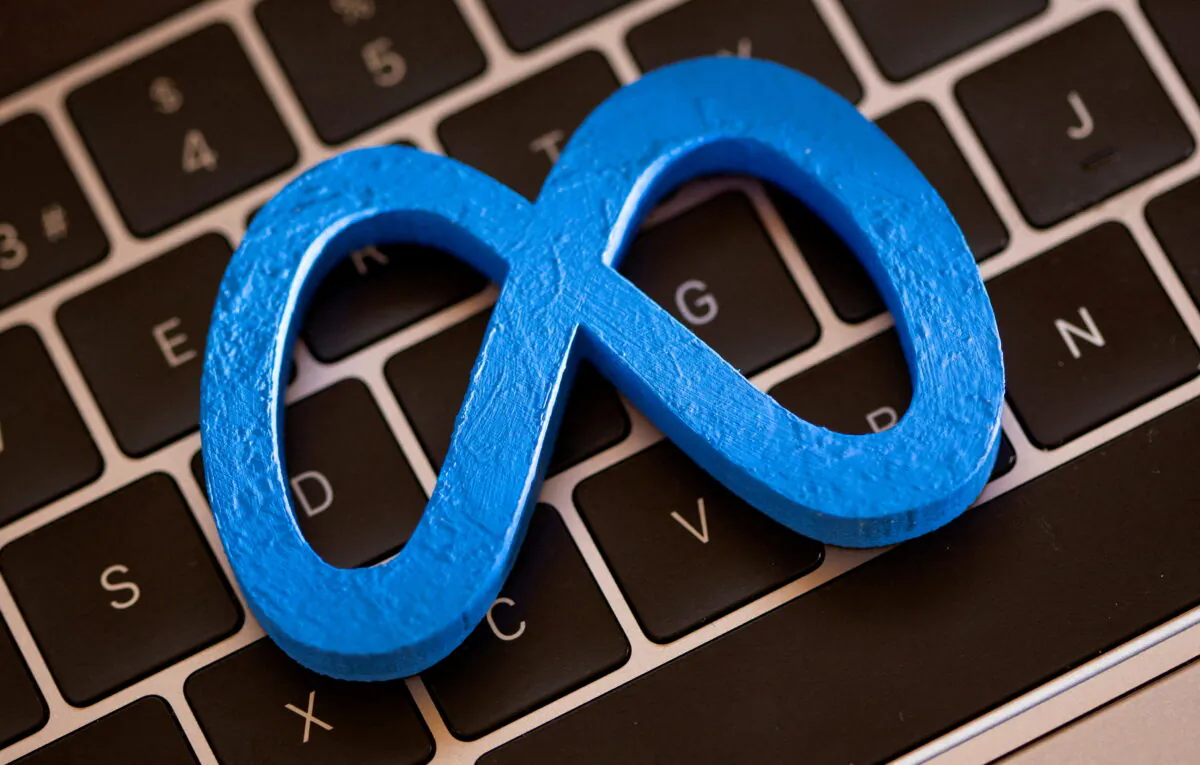 A 3D printed Facebook's new rebrand logo Meta is placed on laptop keyboard in this illustration taken, on Nov. 2, 2021. (Dado Ruvic/Reuters, Illustration/File Photo)