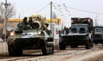 Video Shows Ukrainian ‘Tank Man’ Trying to Block Russian Military Convoy