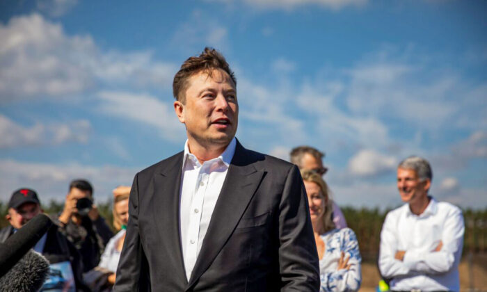 Tesla head Elon Musk talks to the press as he arrives to to have a look at the construction site of the new Tesla Gigafactory near Berlin near Gruenheide, Germany, on Sept. 3, 2020. (Maja Hitij/Getty Images)