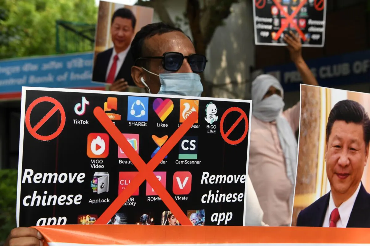 Demonstrators hold placards urging citizens to remove Chinese apps and stop using Chinese products in New Delhi, in this file photo. (Prakash Singh/AFP via Getty Images)