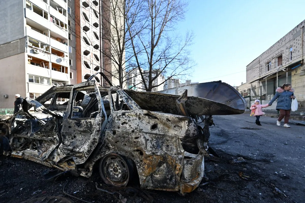 A view of the car which was destroyed by recent shelling in the outskirts of Kyiv, Ukraine, on Feb. 28, 2022. (Genya Savilov//AFP via Getty Images)
