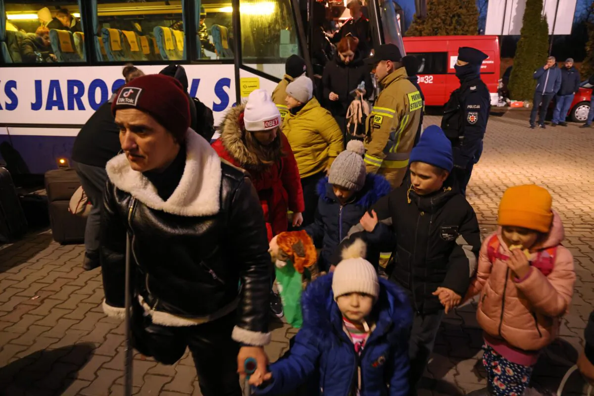 Refugees from Ukraine arrive at a temporary shelter near Korczowa, Poland on Feb. 28, 2022. (Sean Gallup/Getty Images)