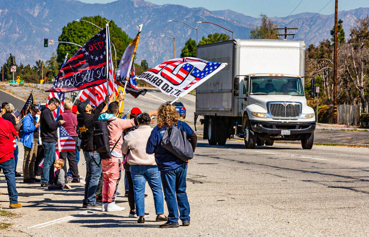 People gather in El Monte, Calif., to show support for truckers partaking in a convoy from Los Angeles to Washington, D.C., in protest of coronavirus mandates, on Feb. 25, 2022. (John Fredricks/The Epoch Times)