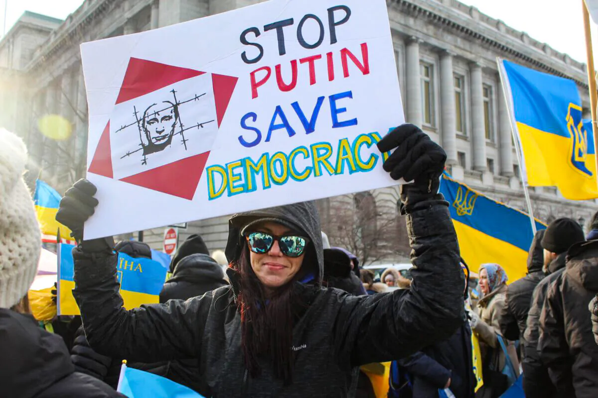 Nadya Reidy of Lakewood, Ohio near Cleveland, shows her support for Ukraine during a rally at Willard Park in downtown Cleveland on Feb. 26. Reidy's family is active in northeast Ohio's Ukrainian community. (Michael Sakal/The Epoch Times)