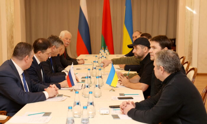 Russian and Ukrainian officials take part in the talks in the Gomel region, Belarus, on Feb. 28, 2022. (Sergei Kholodilin/BelTA/Handout via Reuters)