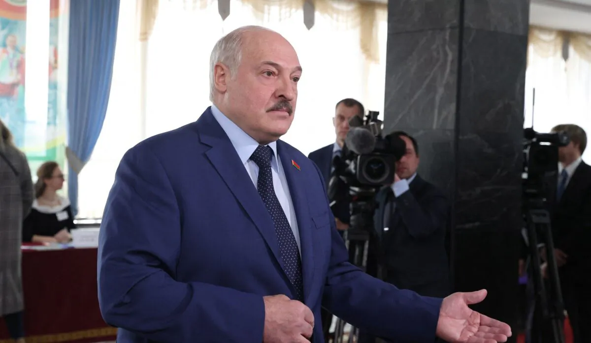 Belarus President Alexander Lukashenko speaks to the media after casting his ballot in the referendum on the constitutional amendments at a polling station in Minsk on Feb. 27, 2022.(Sergei Sheleg/BELTA/AFP via Getty Images)