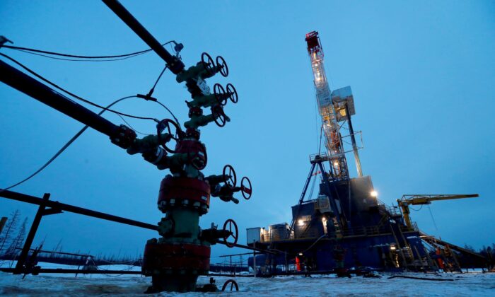A well head and drilling rig in the Yarakta oilfield, owned by Irkutsk Oil Company (INK), in the Irkutsk region, Russia, on March 11, 2019. (Vasily Fedosenko/Reuters)