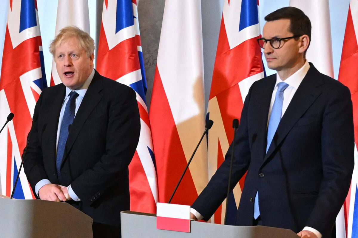 British Prime Minister Boris Johnson (L) and Polish Prime Minister Mateusz Morawiecki give a press conference at the Chancellery in Warsaw, Poland, on March 1, 2022. (Leon Neal /Pool/AFP via Getty Images)